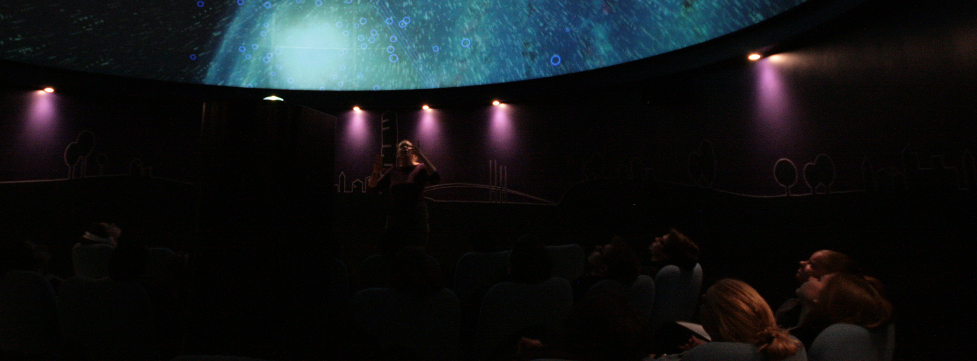 The astronomers guides our visitors on a journey to the planets, stars and galaxies.